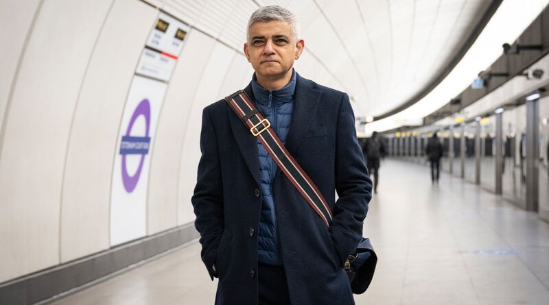 Sadiq walks toward the camera on an Elizabeth line platform.