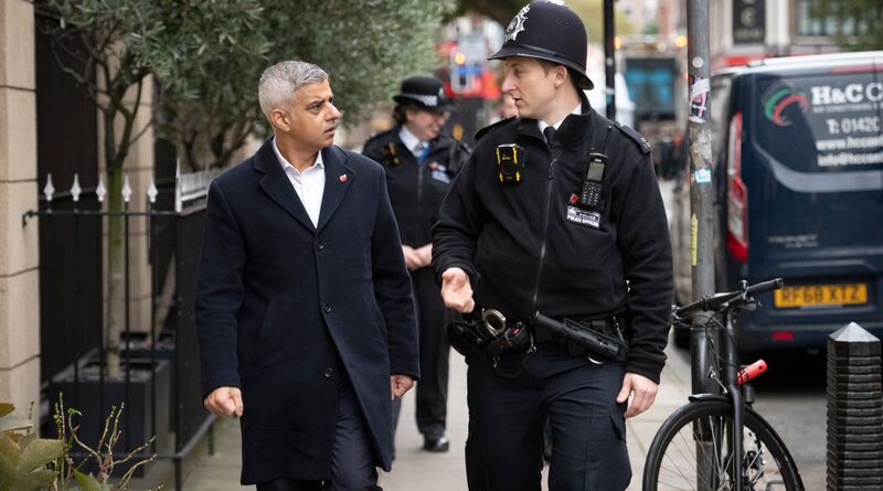 Sadiq walks with police through London.
